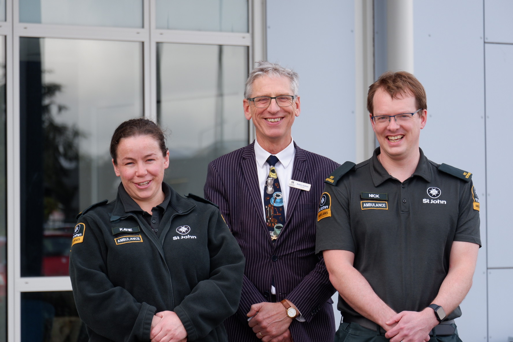 Two Hato Hone St John volunteers with the Principal of Hornby High School