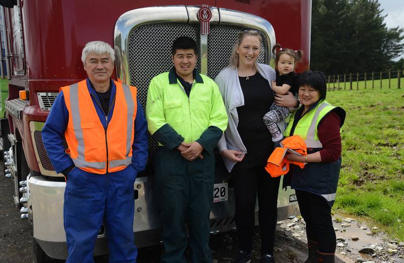 Members of the Young family, in front of a truck